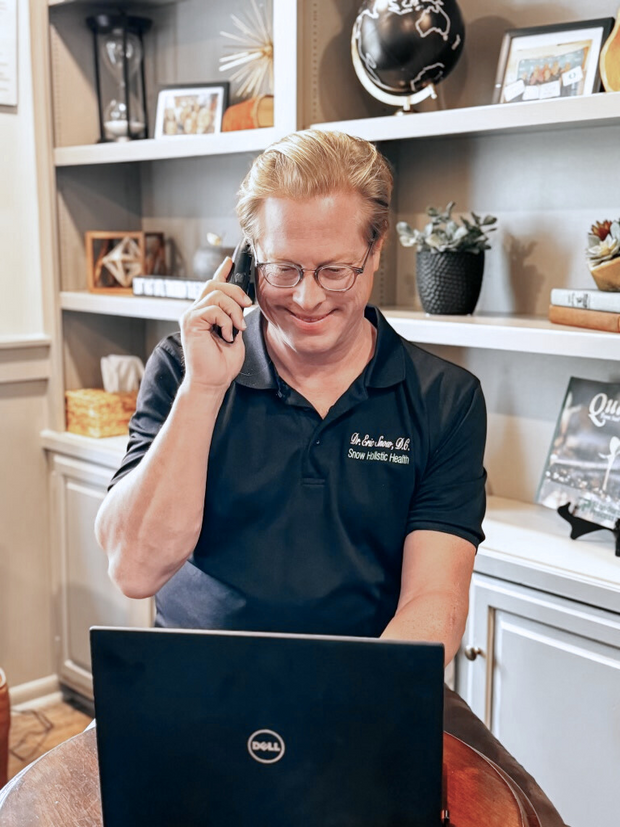 Dr. Eric Snow, DC speaks to an out-of-state patient during a virtual patient care call 